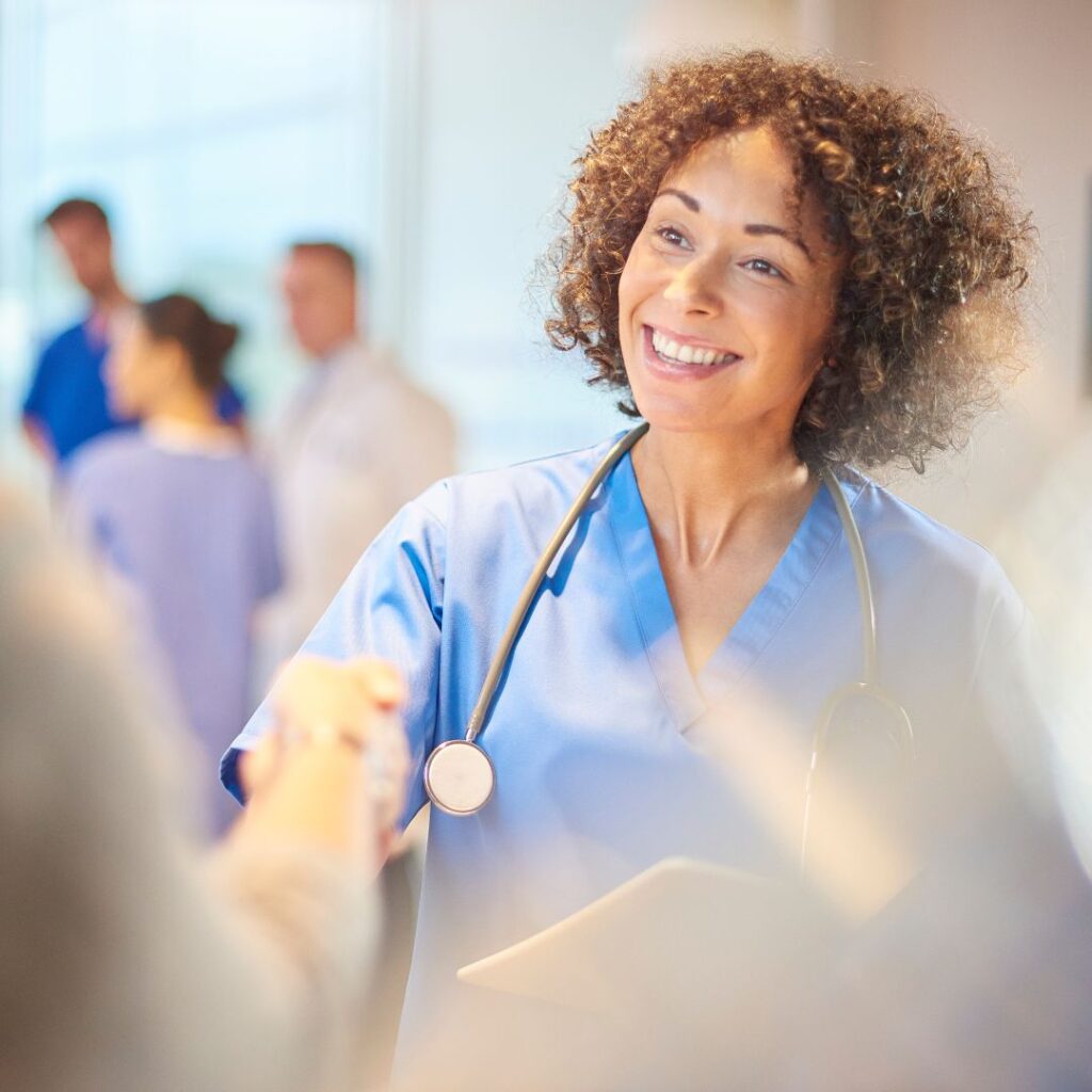 surgeon shaking patient's hand
