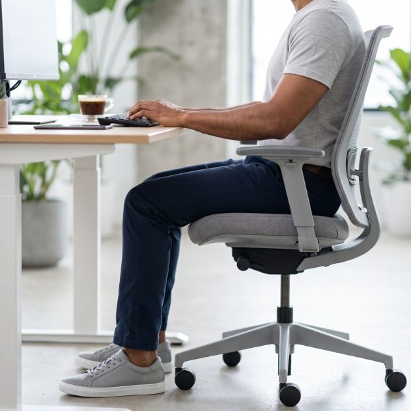 man sitting at computer