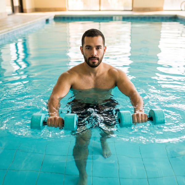 man swimming in pool