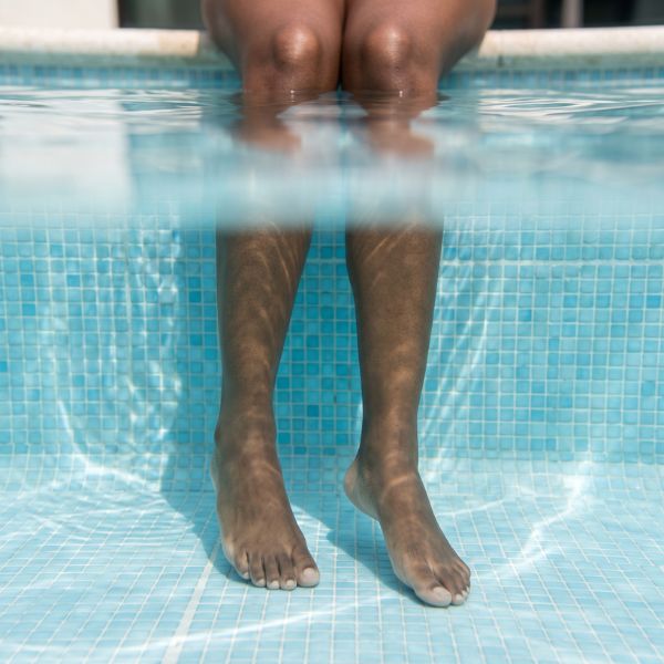woman's legs in pool